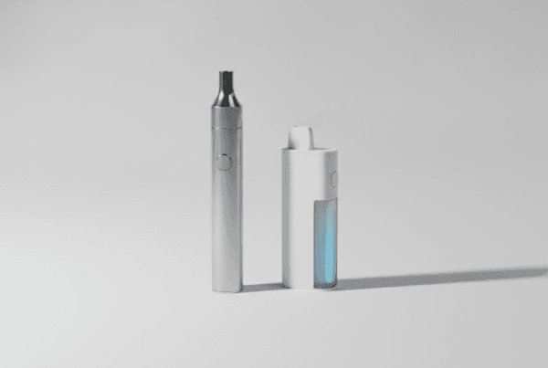 Two vape devices side by side one sleek reusable and one disposable on a clean surface