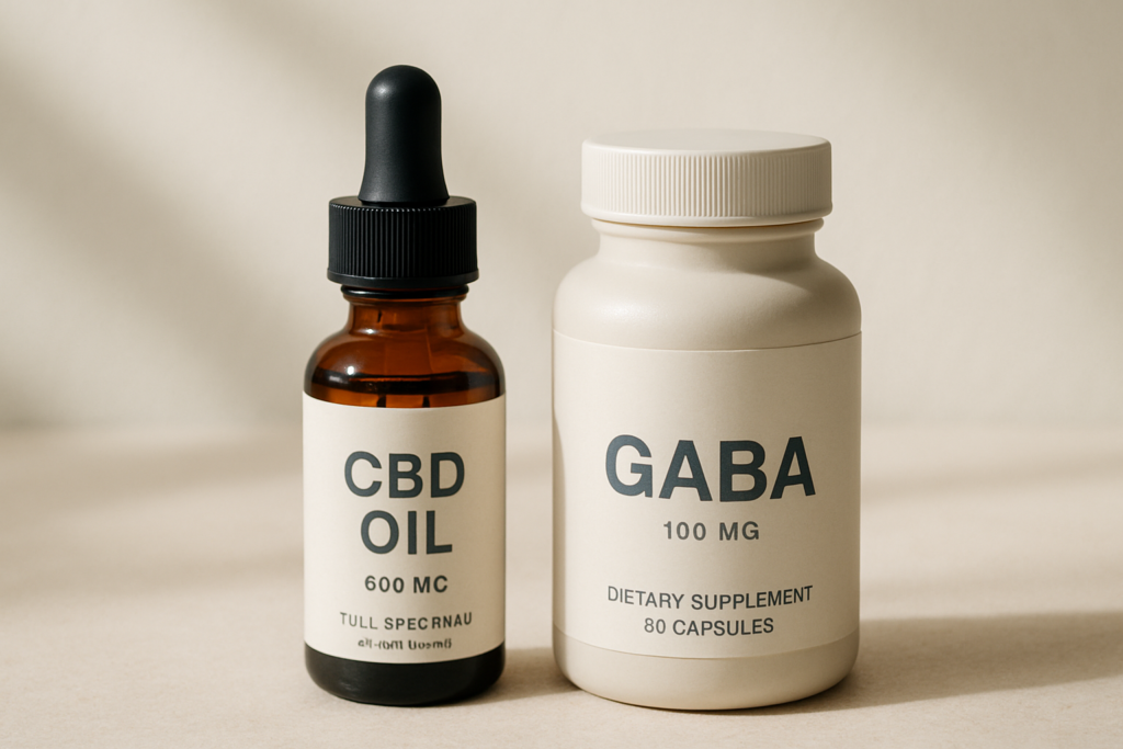 CBD oil bottle beside GABA supplement capsules